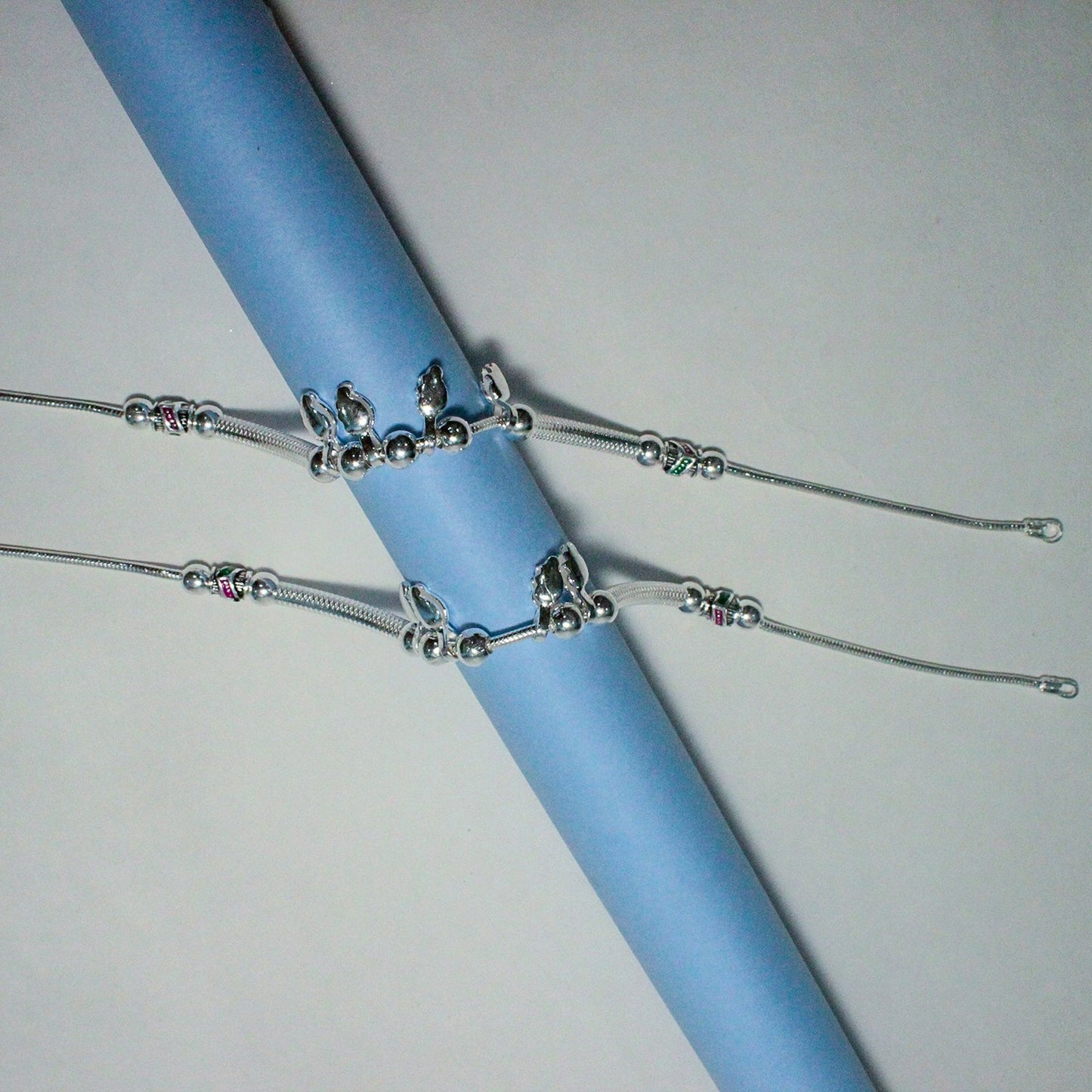 elegant silver payal with delicate hanging charms | shyni - shyni jewellery