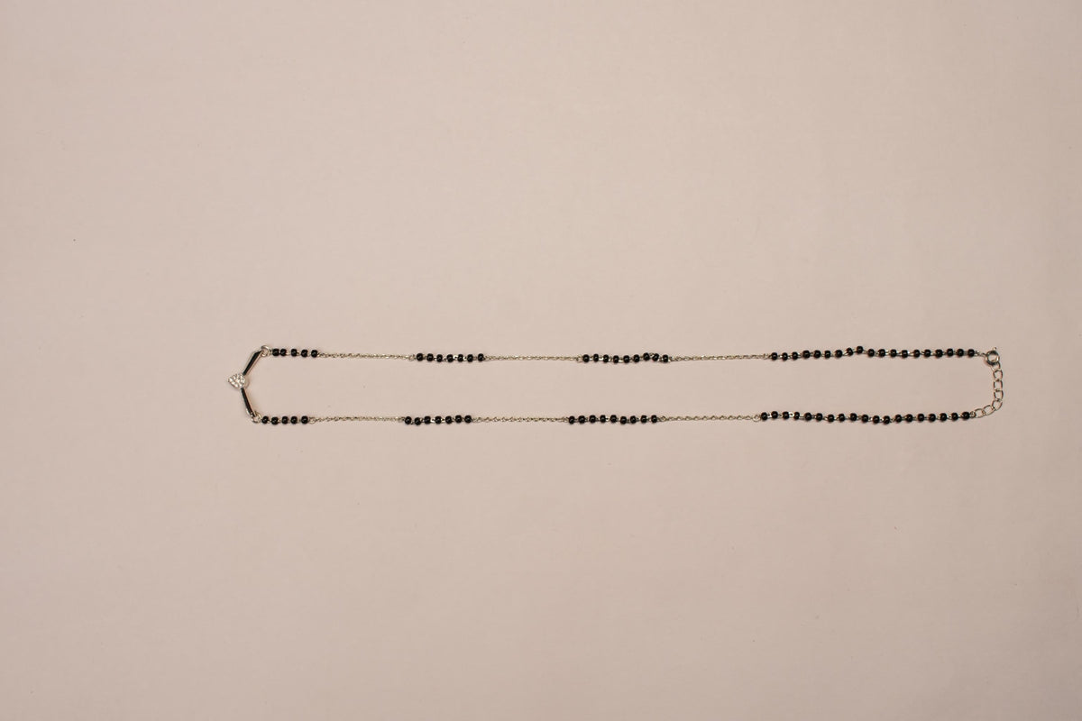 shyni jewelry v-shape mangalsutra pendant with a single stone on a traditional black bead mala chain