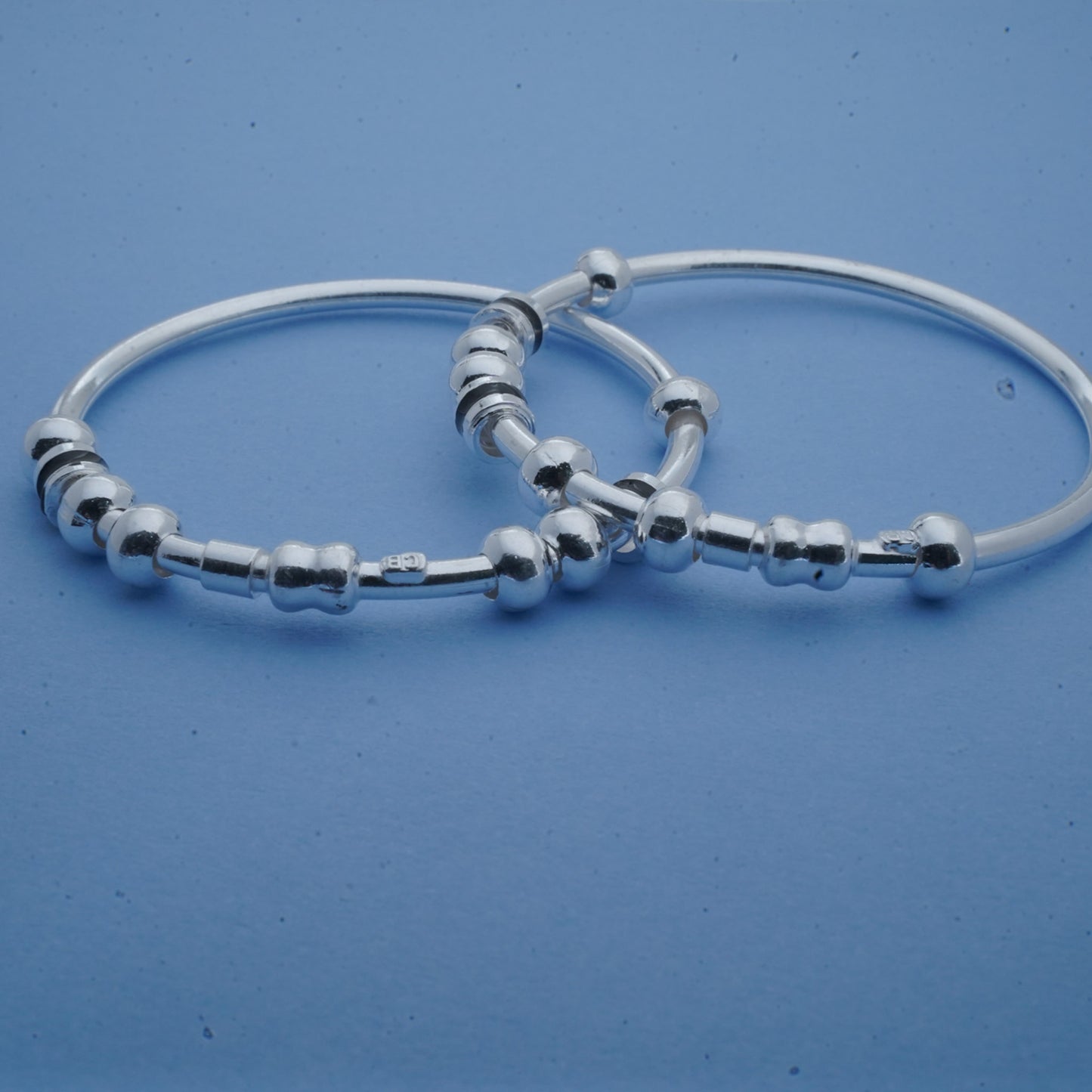 silver kada pair for kids with silver beads and black chilles