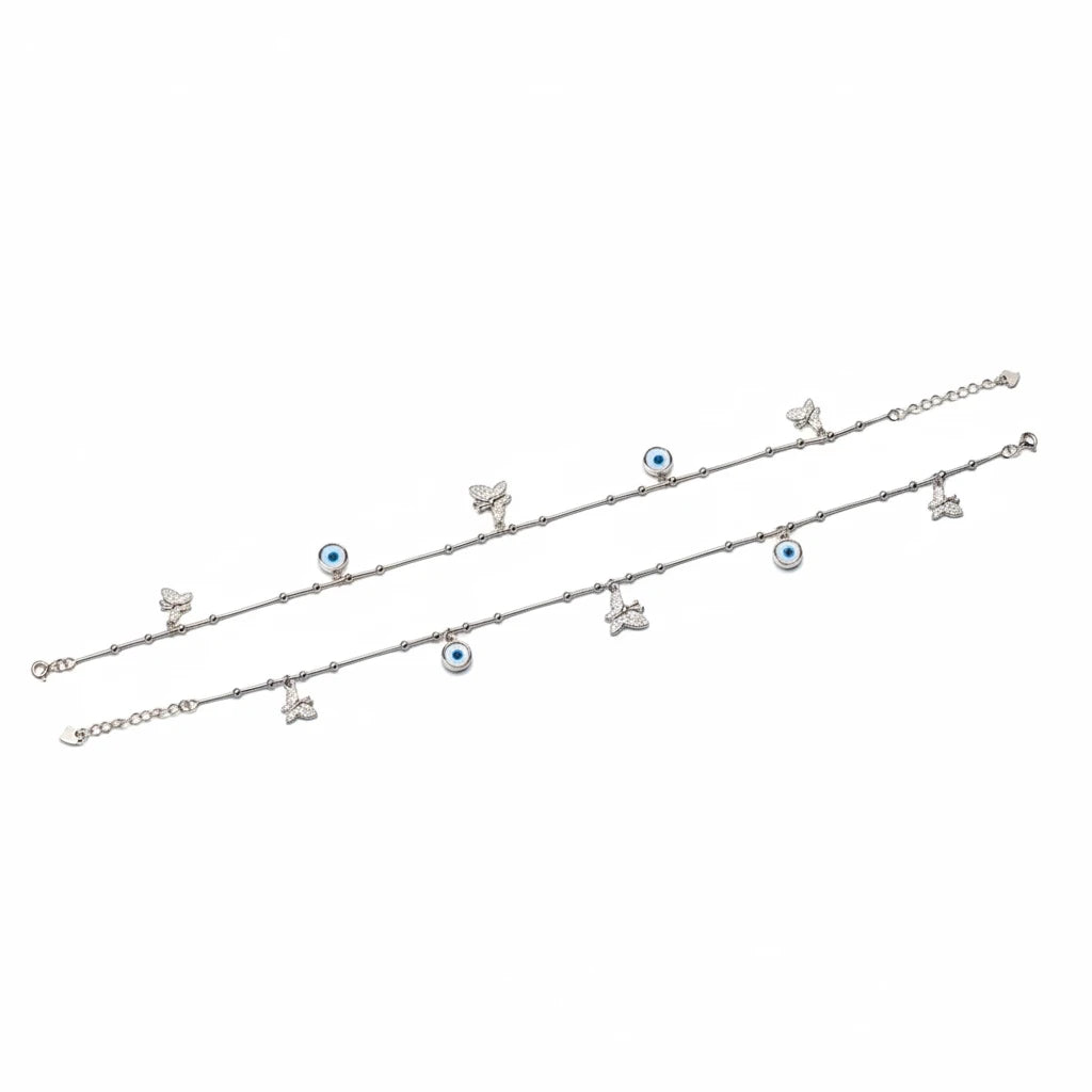 shyni jewelry silver anklet featuring delicate butterfly charms and blue evil eye beads on a thin chain