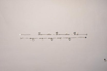 Shyni Jewelry silver charm anklets featuring delicate chains with sparkling round and teardrop-shaped charms