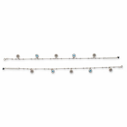 Shyni Jewelry silver chain anklet featuring alternating evil eye charms and sparkling crystal-encrusted discs