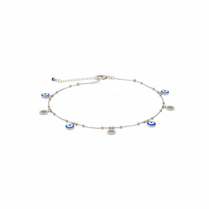 Shyni Jewelry silver anklet featuring blue and white evil eye charms and small metallic beads on a delicate chain.