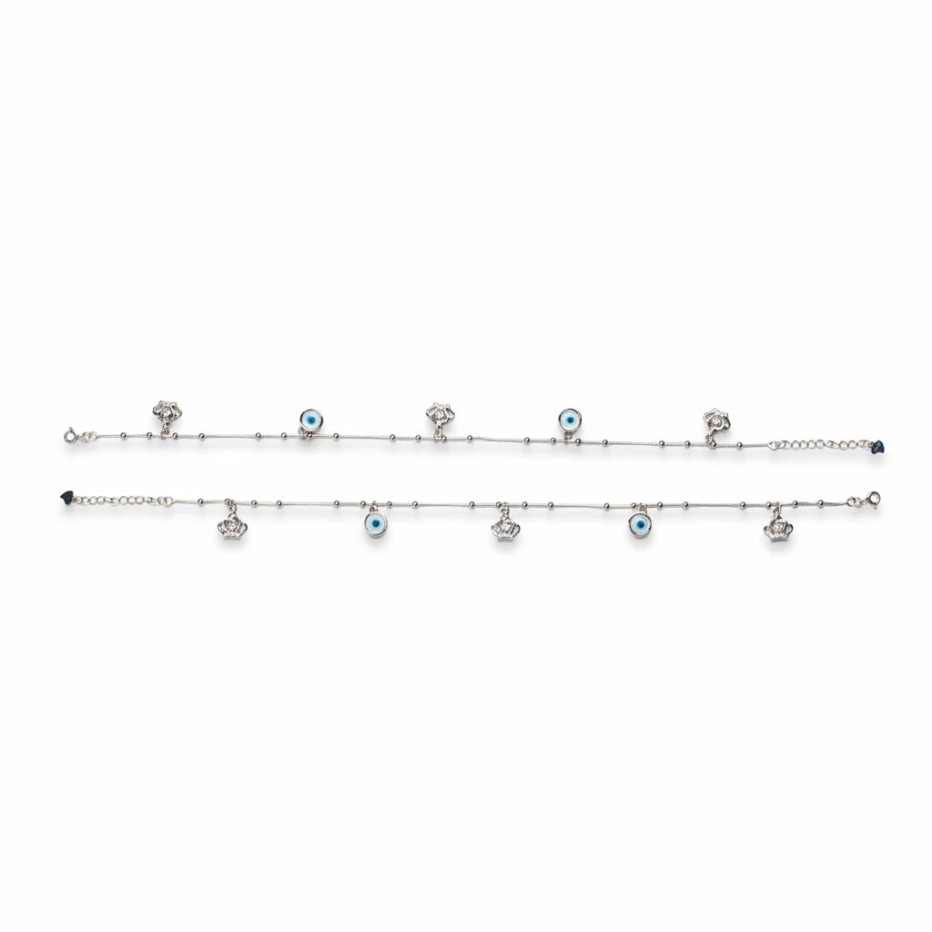 Shyni Jewelry silver anklet featuring alternating evil eye charms and small crown pendants on a delicate chain
