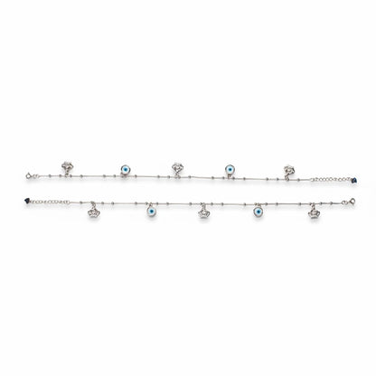 Shyni Jewelry silver anklet featuring alternating evil eye charms and small crown pendants on a delicate chain