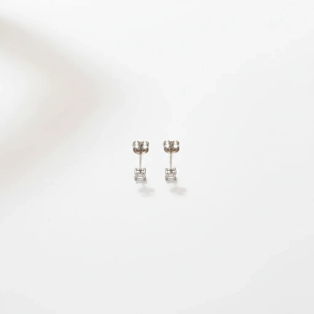 Shyni Jewelry square-shaped silver stud earrings with clear stones on a clean white background
