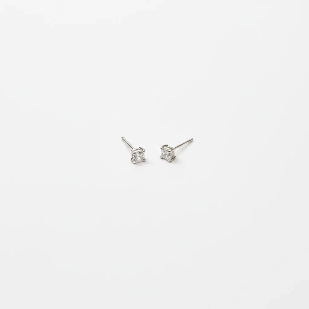 Shyni Jewelry square-cut clear stud earrings in a minimalist silver setting on a clean white background.