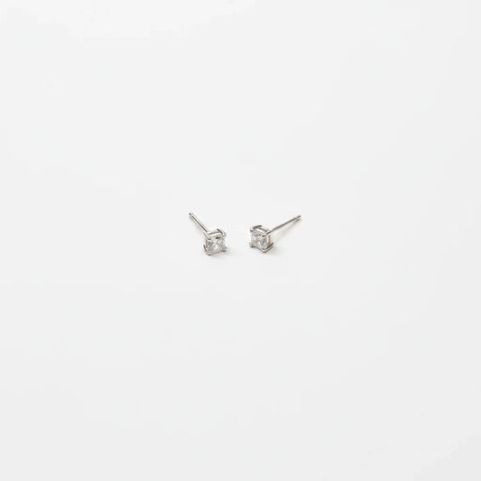 Shyni Jewelry square-cut clear stud earrings in a minimalist silver setting on a clean white background.