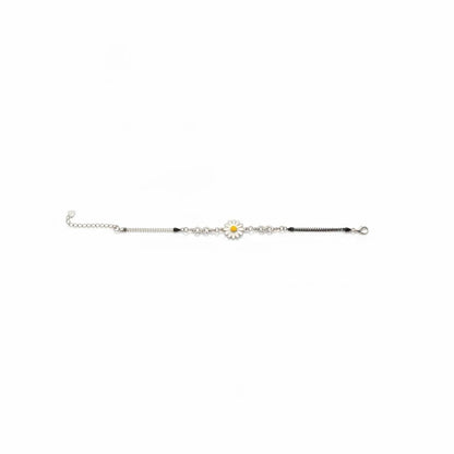 Shyni Jewelry silver chain bracelet featuring a white and yellow enamel sunflower charm and infinity link detail