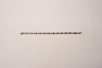 Shyni Jewelry men's two-tone bracelet featuring a gold and silver Greek key pattern link design with a lobster clasp.