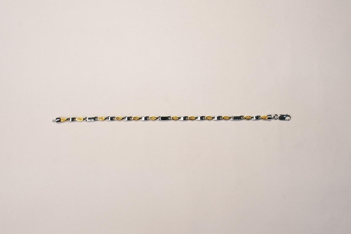 Shyni Jewelry two-tone textured link bracelet featuring alternating gold and silver-toned geometric metal links.