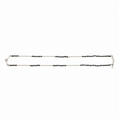 Shyni Jewelry V-shape mangalsutra pendant with a sparkling stone on a traditional black bead mala chain