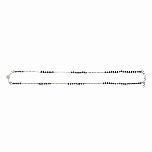 Shyni Jewelry V-shape mangalsutra pendant with a sparkling stone on a traditional black bead mala chain